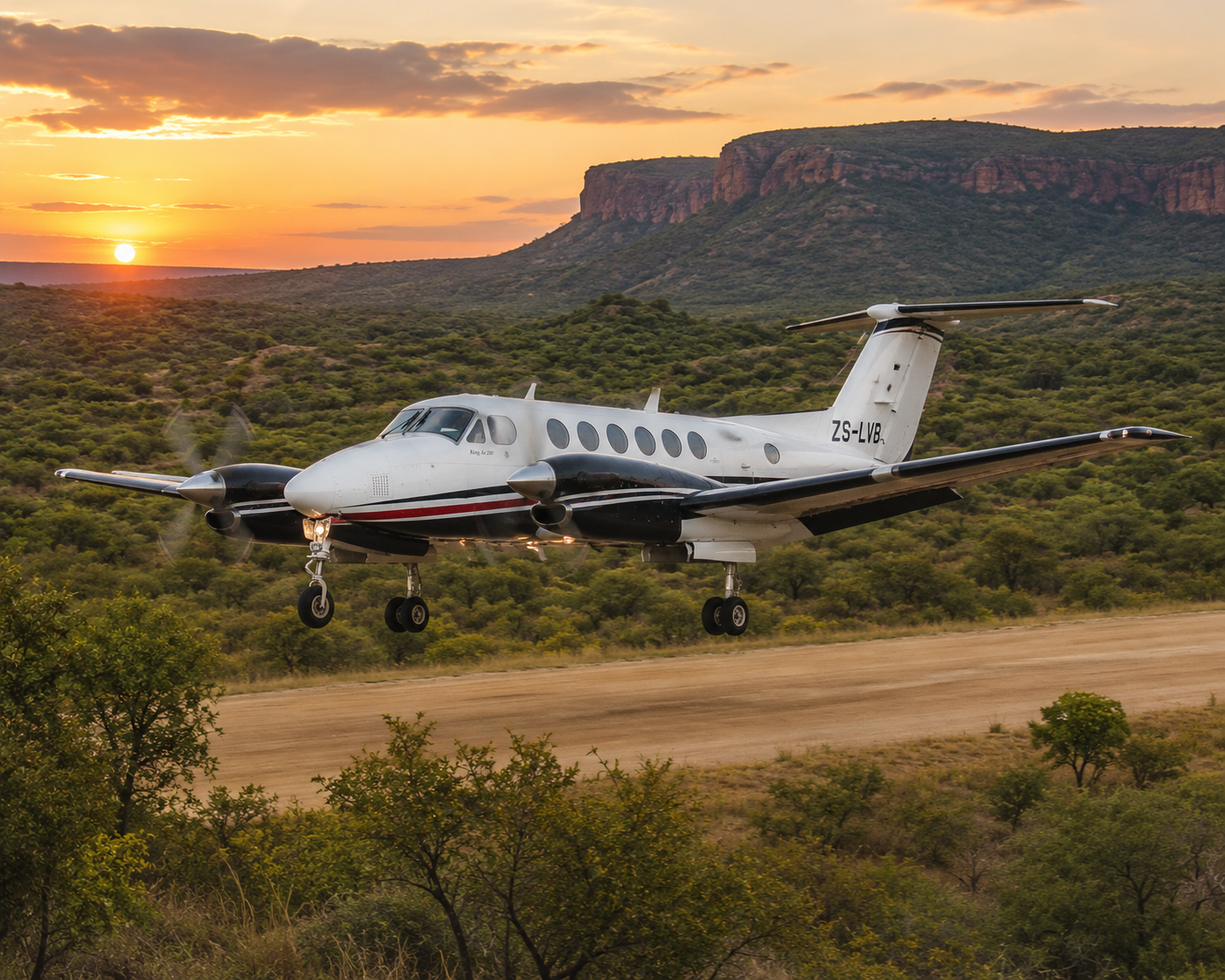 King Air landing in the African bush at sunset